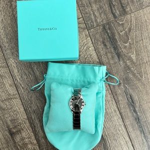 Rarely worn. No scratches. Extra band extender. In original box with bags.